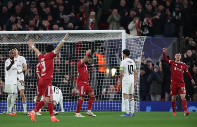 Mohamed Salah (C) of Liverpool celebrates