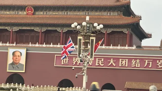 UK flag alongside China flag in Tiananmen Square