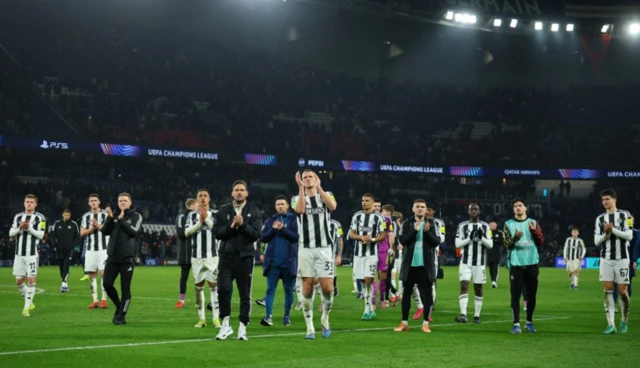 Newcastle United's Dan Burn applauds fans after the match with teammates, Newcastle United assistant manager Jason Tindall and Newcastle United manager Eddie Howe