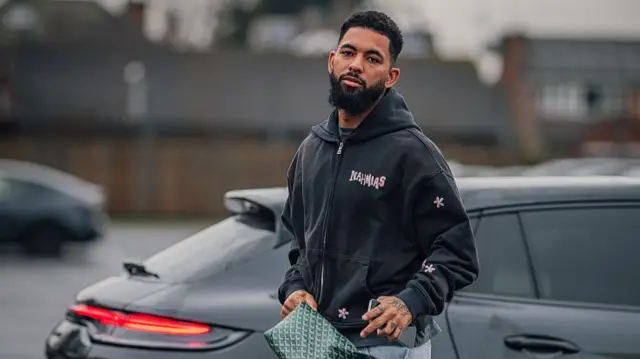 Douglas Luiz at the City Ground car park