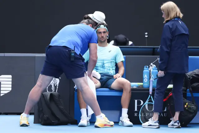 Lorenzo Musetti receives treatment
