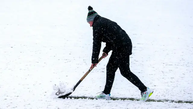 Someone shovelling snow
