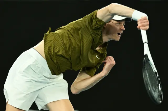 Jannik Sinner serves