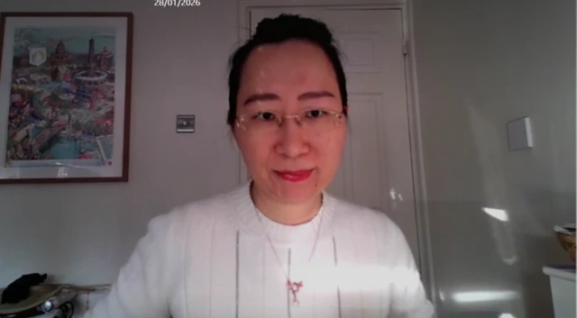 Dr Yu Jie speakiing to the news channel via video link in her home.