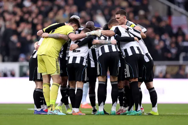 Newcastle players huddle pre-Aston Villa