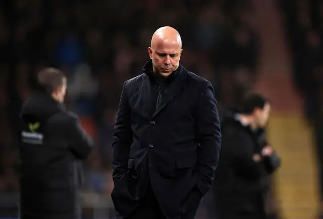 Slot looks glum on the touchline
