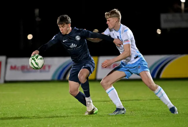 Ballymena's Joel Thompson with Larne's Matthew Lusty