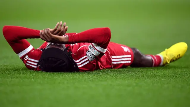 Jeremie Frimpong lays on floor after suffering injury