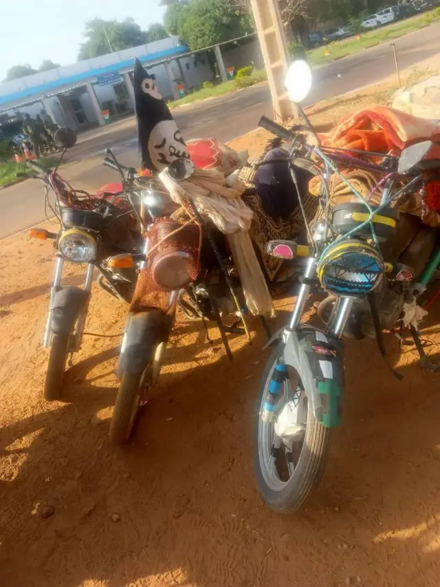 An image of three motorbikes - one has the Shahada flag associated with al-Qaeda and the Islamic State group