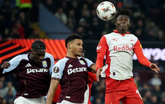 Aston Villa's Amadou Onana and Ollie Watkins in action with RB Salzburg's Karim Konate