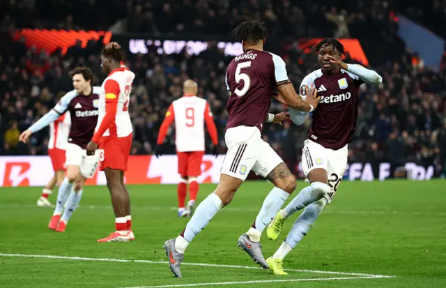Tyrone Mings of Aston Villa celebrates scoring his team's second goal with teammate Jamaldeen Jimoh-Aloba