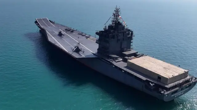 The Iranian drone carrier IRIS Shahid Bagheri which has a flat deck and a large central superstructure