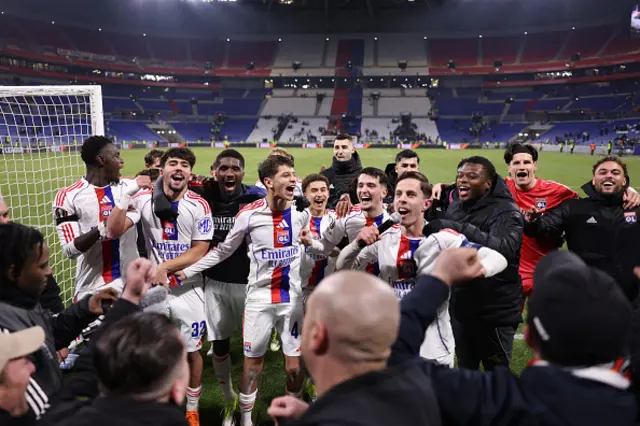 Lyon's players celebrate their victory at the end