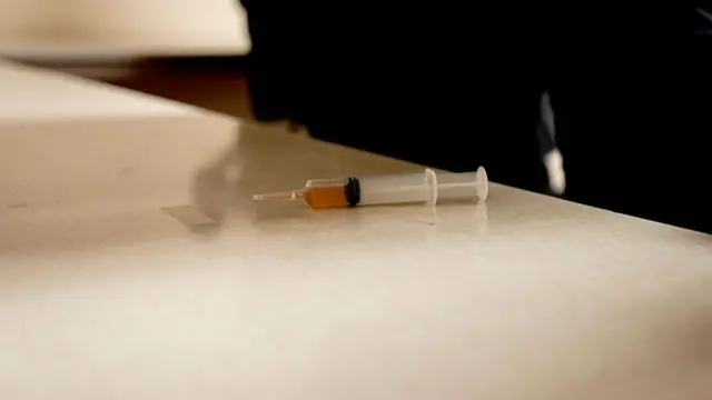 A syringe lays on a countertop after a man approached Representative Ilhan Omar