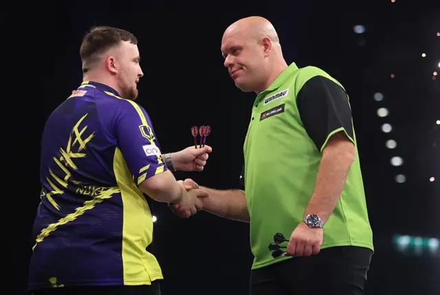 Luke Littler and Michael van Gerwen shaking hands