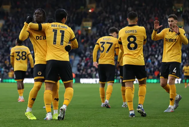 Jhon Arias of Wolverhampton Wanderers celebrates scoring his team's first goal with teammate