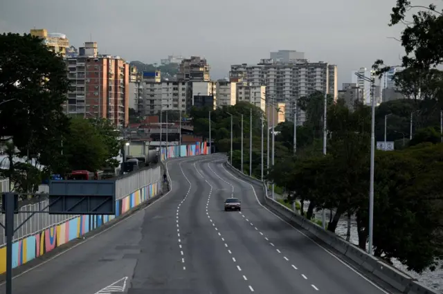 A highway with only one car on it in caracas