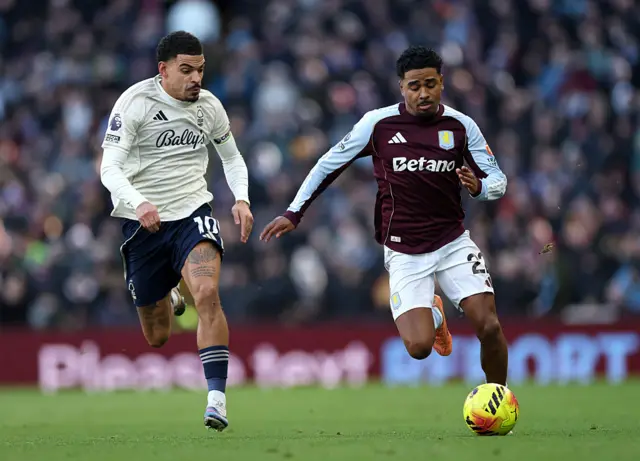 Ian Maatsen of Aston Villa battles for possession