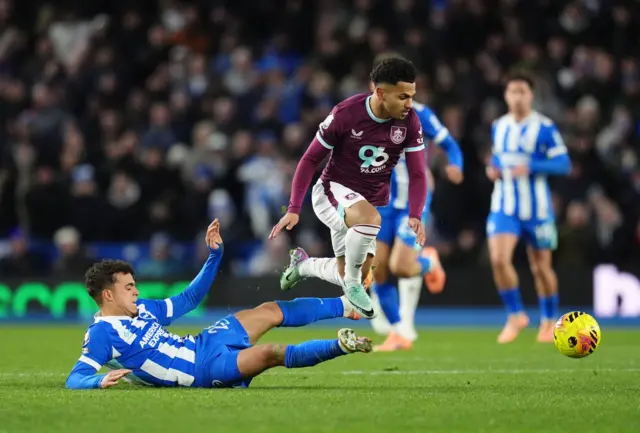 Brighton and Hove Albion's Yasin Ayari and Burnley's Marcus Edwards battle for the ball