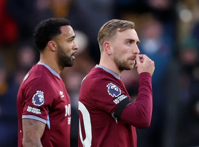 West Ham United's Jarrod Bowen and Callum Wilson look dejected after Wolverhampton Wanderers' Mateus Mane scores their third goal