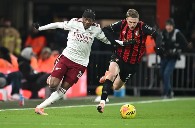 Noni Madueke of Arsenal and Adrien Truffert of AFC Bournemouth battle for possession during the Premier League match between Bournemouth and Arsenal at Vitality Stadium on January 03, 2026 in Bournemouth, England.