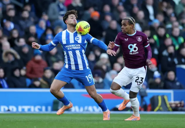 Brighton & Hove Albion's Charalampos Kostoulas in action with Burnley's Lucas Pires