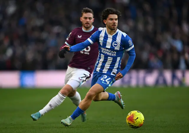 Ferdi Kadioglu of Brighton & Hove Albion runs with the ball