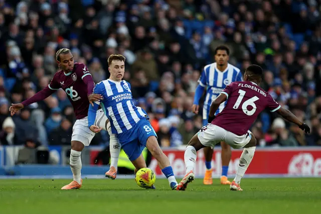 Brajan Gruda of Brighton & Hove Albion battles for possession with Florentino Luis of Burnley