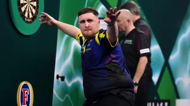 Luke Littler celebrates a 170 checkout