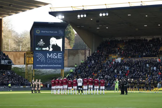 General view during a minute's silence in memory of Terry Wharton before the match.
