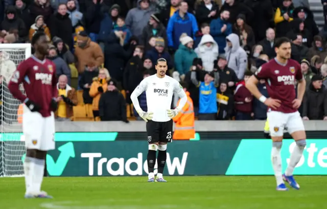 West Ham United goalkeeper Alphonse Areola (centre) reacts after conceding their side's third goal of the game
