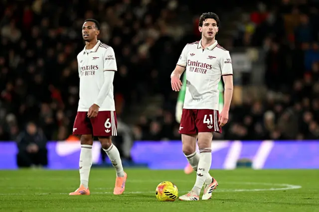 Declan Rice and Gabriel of Arsenal look on
