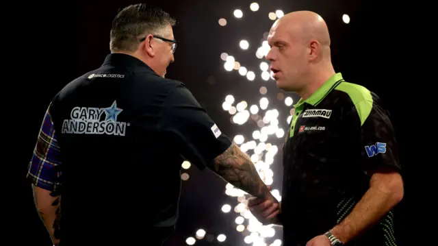 Gary Anderson shakes hands with Michael van Gerwen