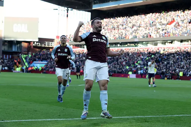 Aston Villa's Scottish midfielder #07 John McGinn celebrates after scoring their third goal