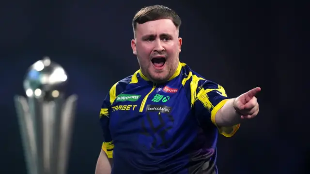 Luke Littler celebrates