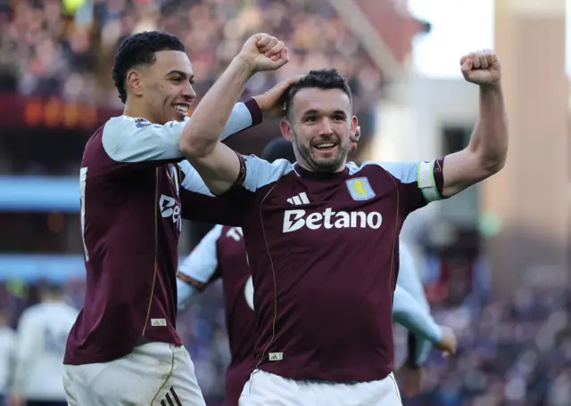 Aston Villa's John McGinn celebrates scoring their second goal with Morgan Rogers