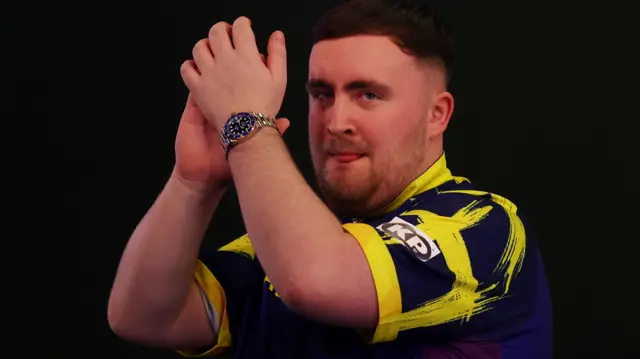 Luke Littler applauds