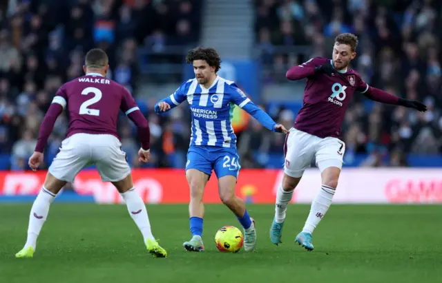 Brighton & Hove Albion  in action with Burnley