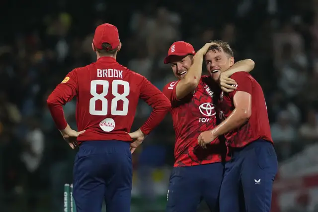 Sam Curran celebrates his hat-trick with his England team-mates