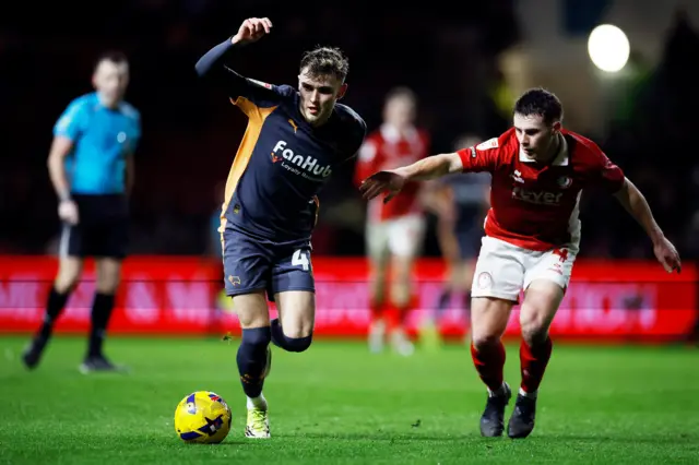 Bobby Clark of Derby County is challenged by Adam Randell of Bristol City