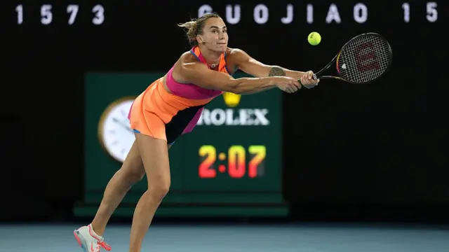 Aryna Sabalenka plays a backhand