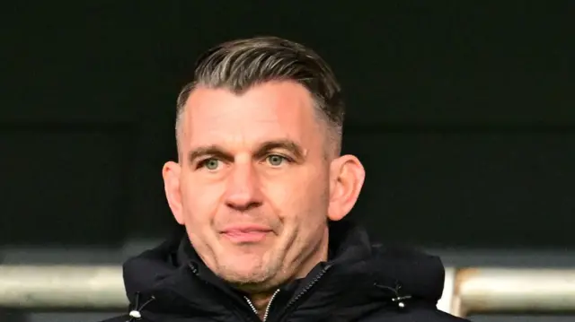 Oxford United boss Matt Bloomfield looking on from the stands