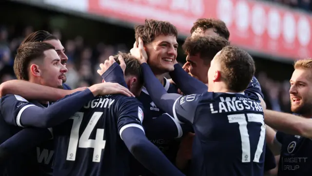 Millwall players celebrate a goal in their 4-0 win over Charlton