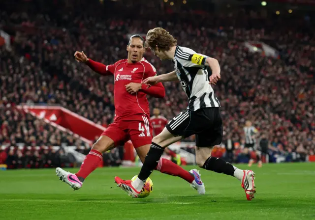 Gordon dribbles down the wing and nutmegs van Dijk