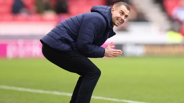Southampton head coach Tonda Eckert claps his team