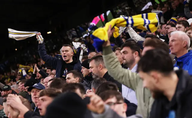 Leeds fans chant and waves scarves