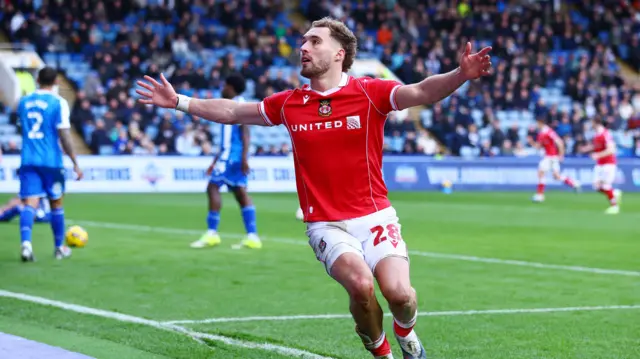 Wrexham's Sam Smith celebrates with his arms wide open