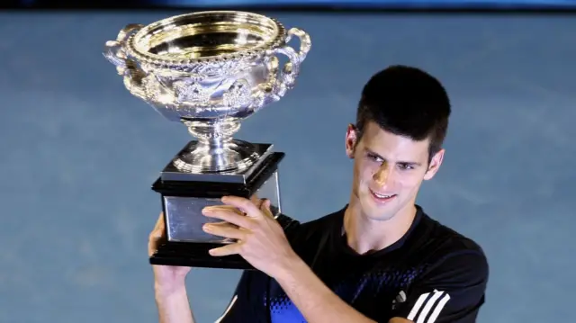 Novak Djokovic holds the Australian Open trophy in 2008