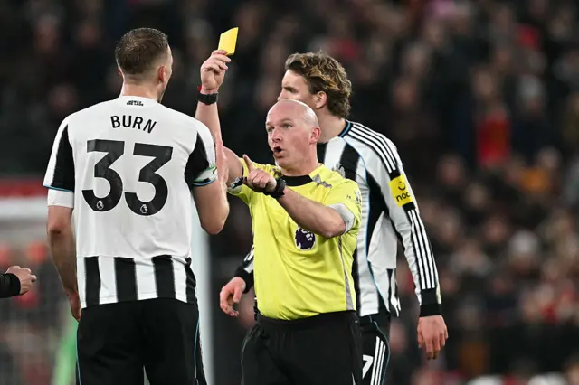 Burn is booked by referee Hooper