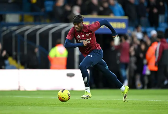 Madueke runs with the ball in the warm up